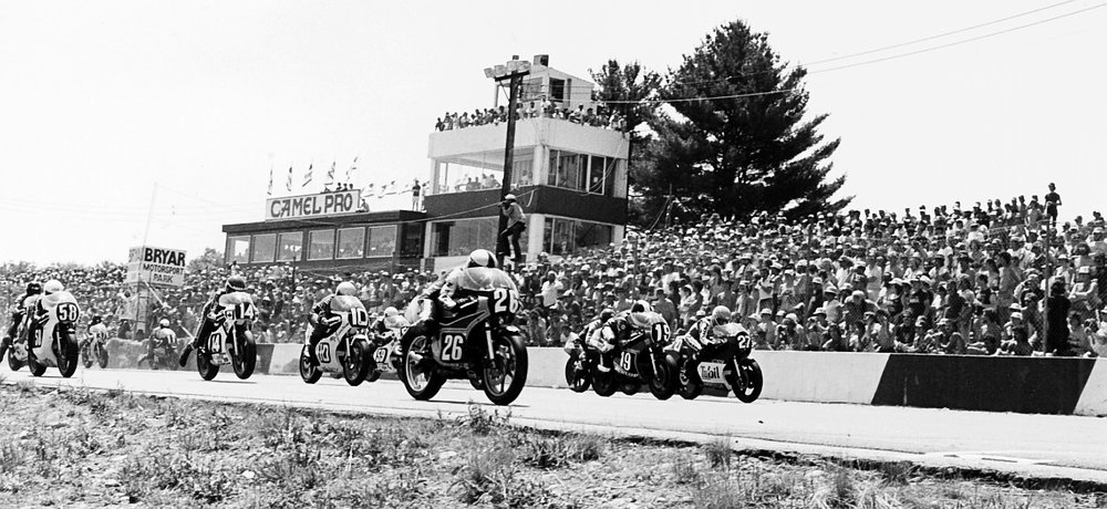 race grid in front of full grandstands at Bryar Motorsports Park