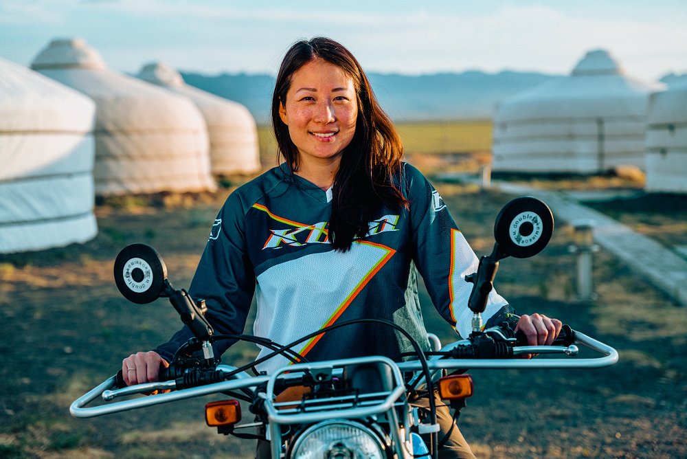 Anna Kim on a motorcycle