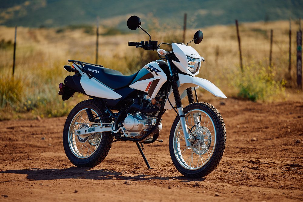 Honda XR150L parked on a dirt road
