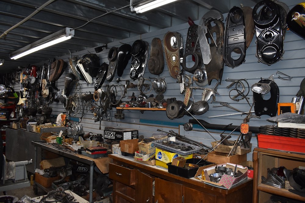 parts on the wall in the restoration shop