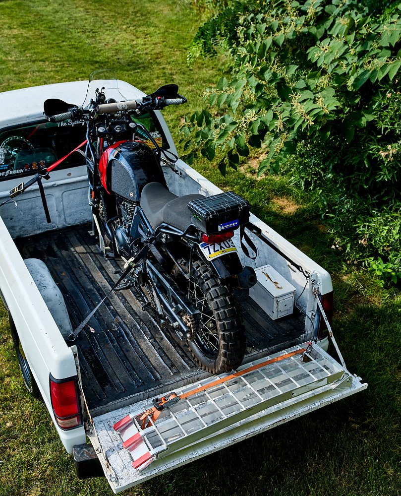 motorcycle loaded in truck bed
