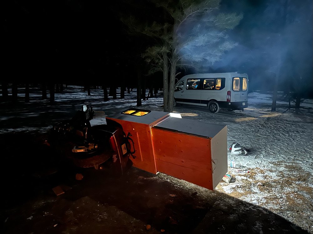 A 1989 Honda Gold Wing tipped over in a camp site at night.