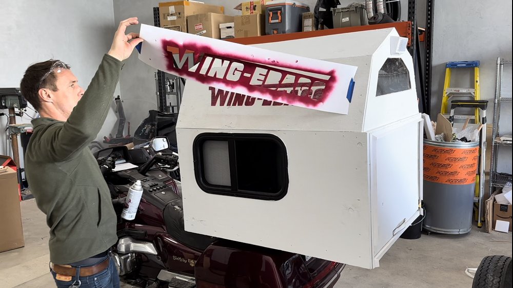 The Wing-ebago logo being painted on the side of a 1989 Honda Gold Wing.