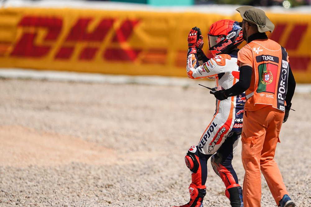 Marc Marquez holding hands together after his crash in Portugal