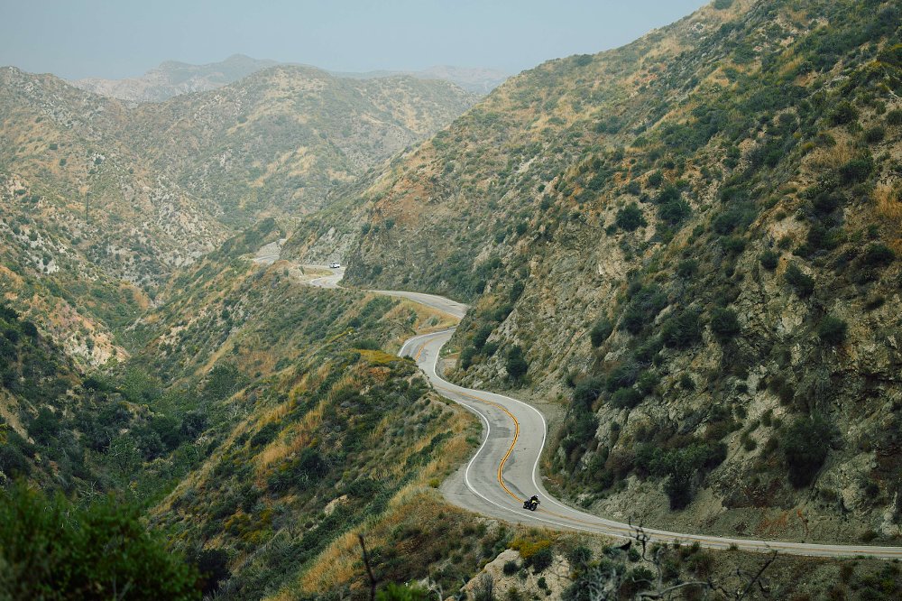 distant view of the V-Strom 800DE on a mountain road