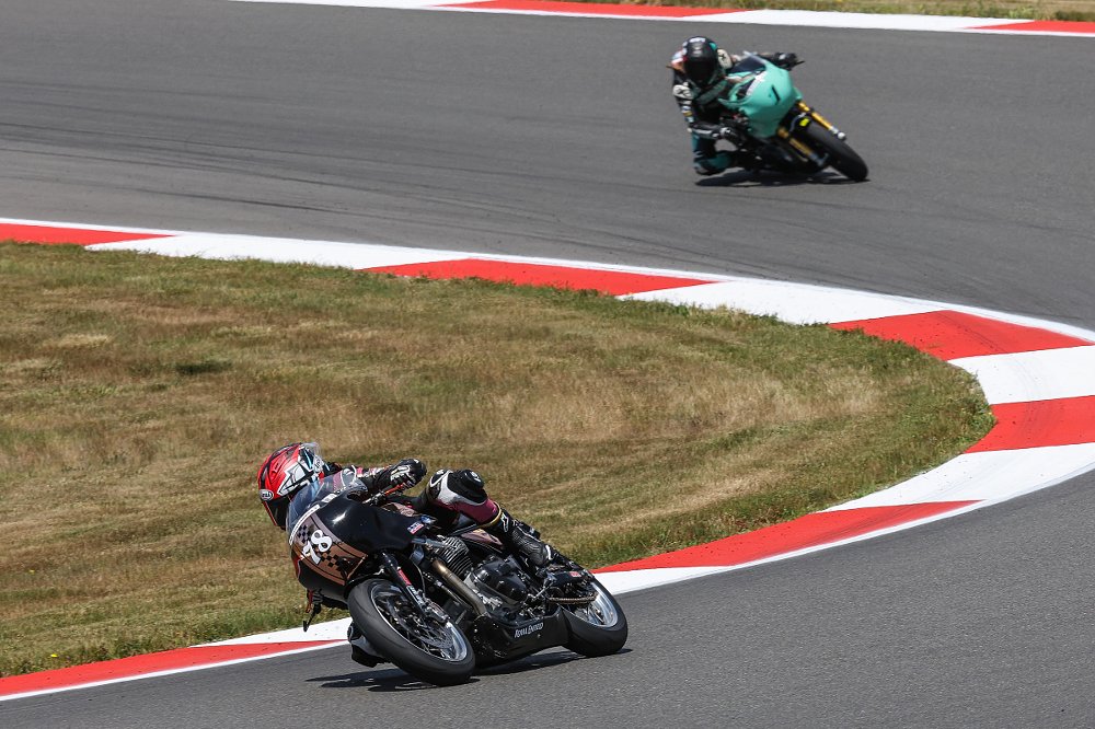 Mikayla Moore leading Kayleigh Buyck on the track