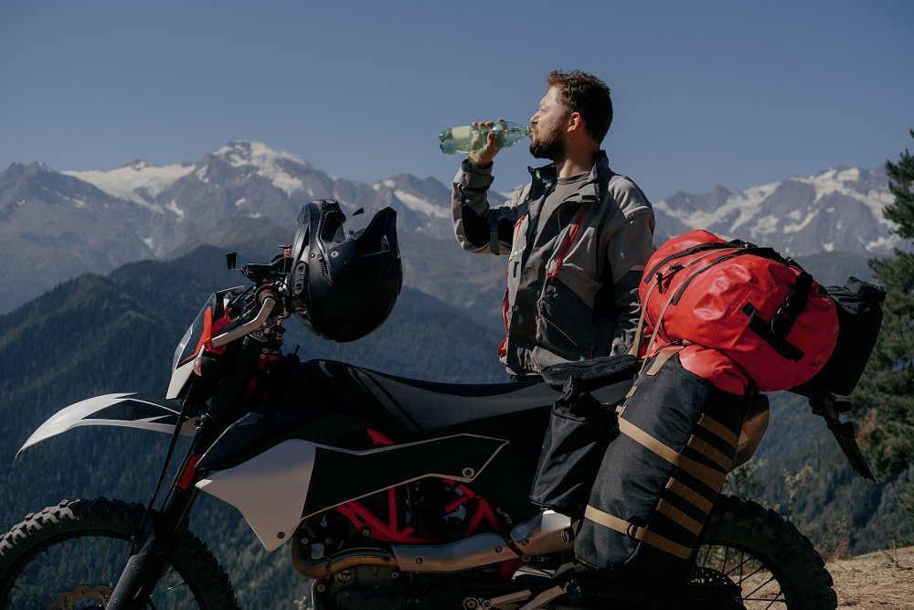 motorcycle rider drinking water