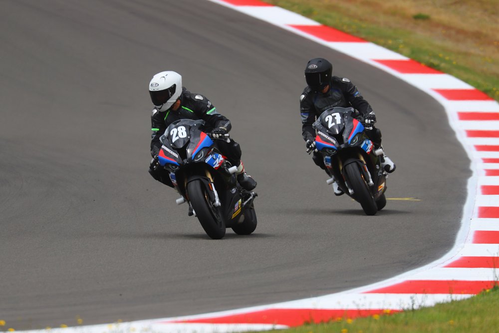 father and son riding on the track
