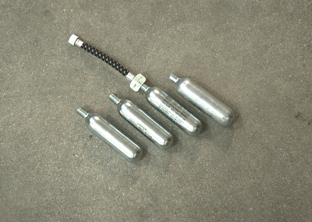 CO2 canisters for filling a motorcycle tire