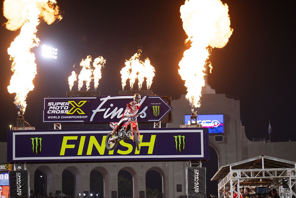Jett Lawrence flying through the air across the finish line to win at Los Angeles