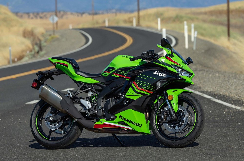 a static photo of the bright green kawasaki ZX-4RR sportbike parked on a back country road