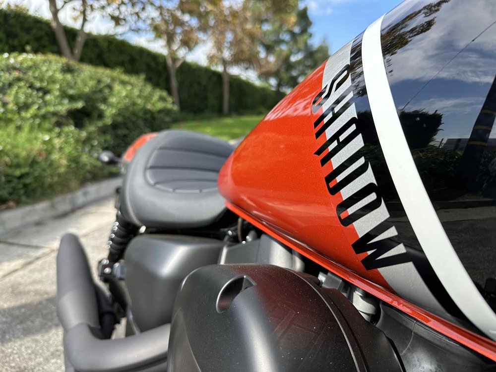 closeup of orange and black logo on the Honda Shadow Phantom tank