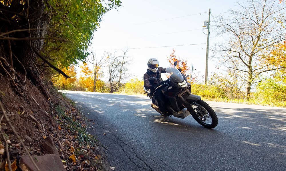 Transalp in a curve on a paved road