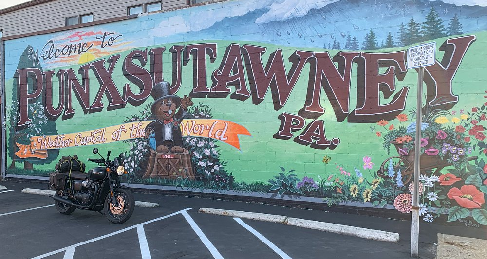 motorcycle parked in front of the Punxsutawney mural
