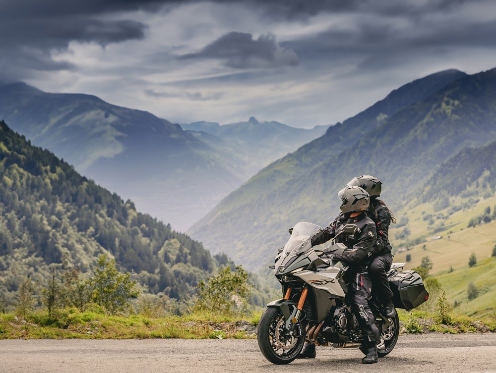 rider and passenger on the GSX-S1000GX+ on a mountain road