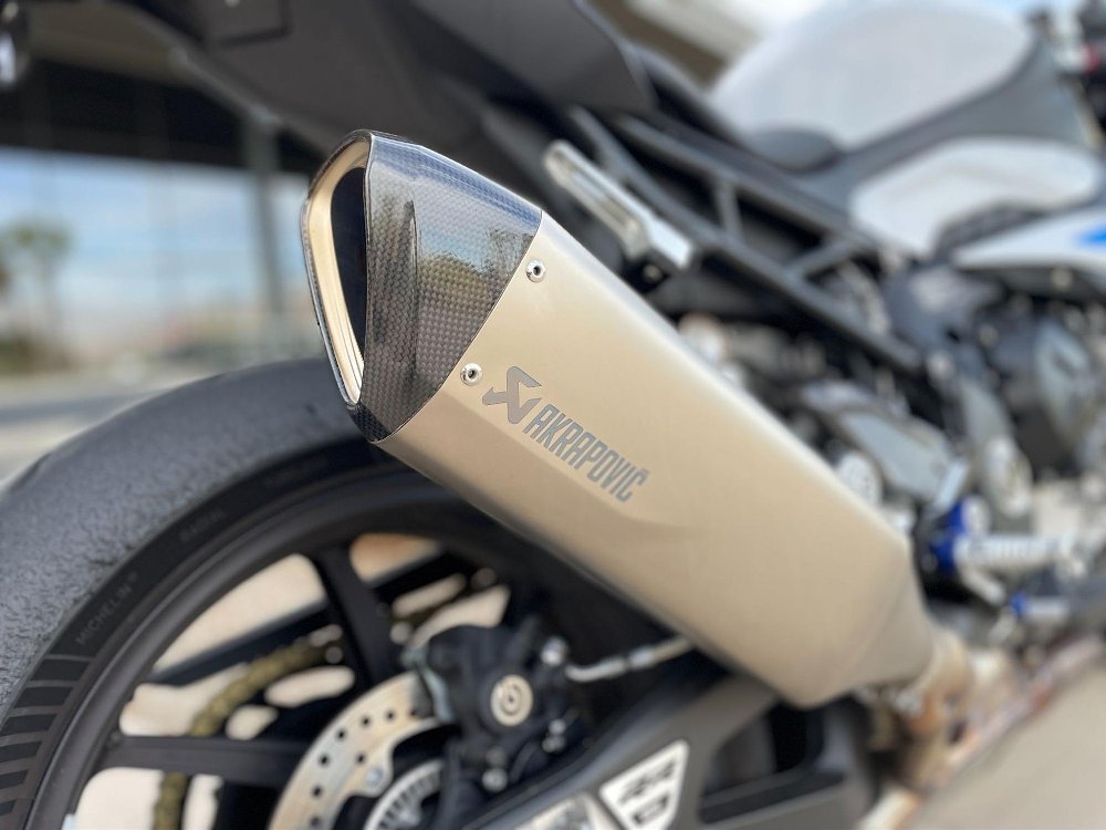 A close up of the titanium and carbon tip exhaust on the bmw s 1000 rr