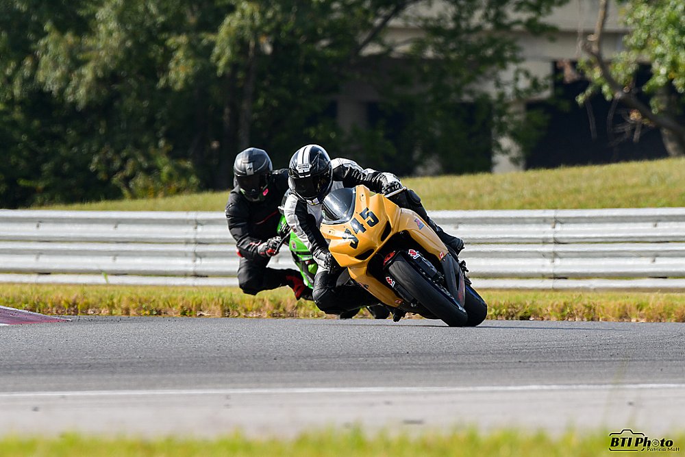 Peter on the track on his yellow Suzuki GSX-R750