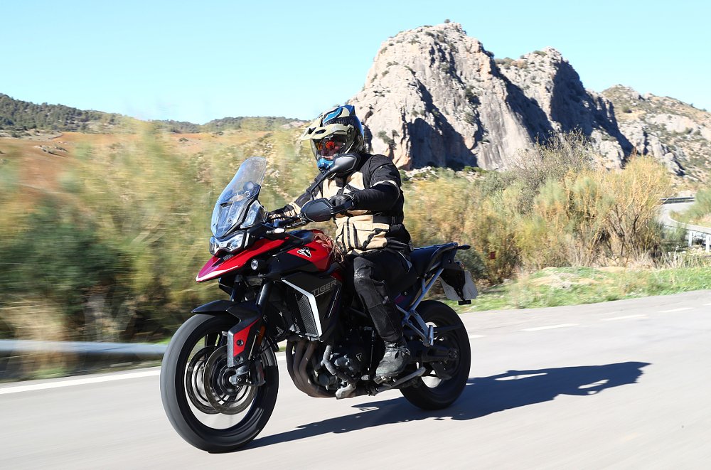 riding the Triumph Tiger 900 GT Pro on the road in Spain