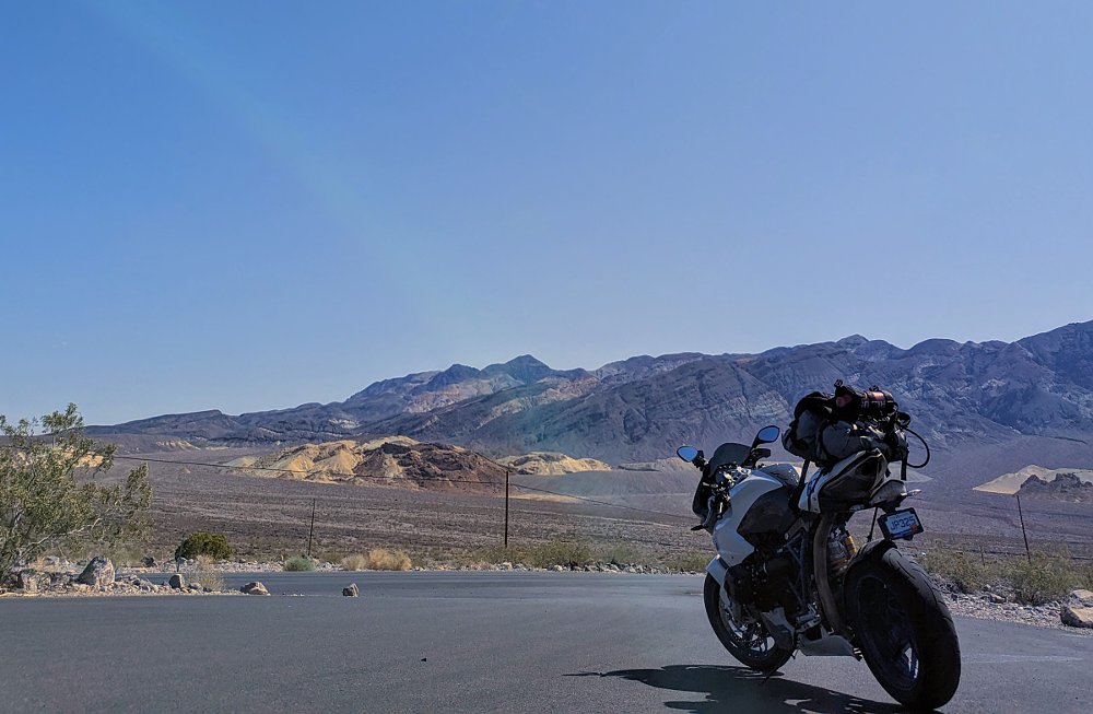 BMW HP2 that appears to be parked at the end of a rainbow