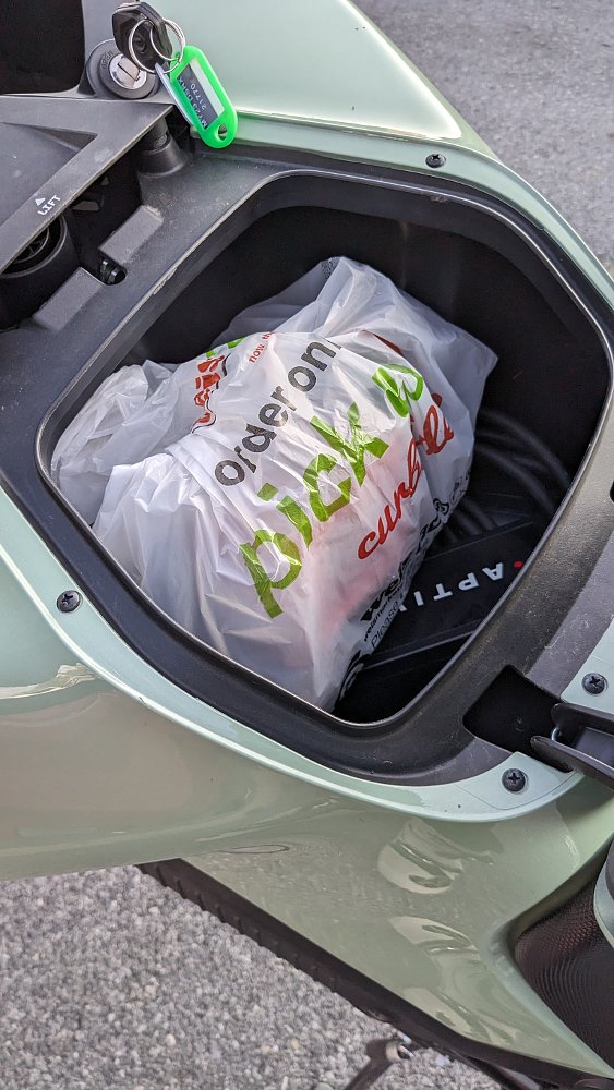 a grocery bag in the storage area of the Zero DSR/X