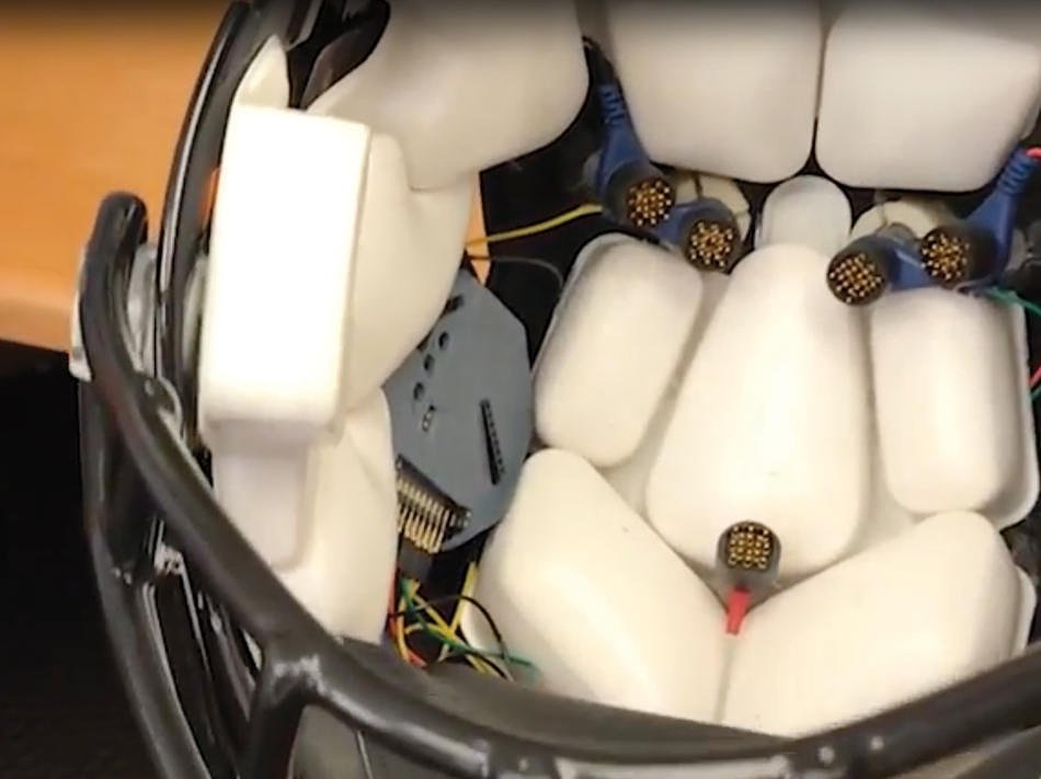 The inside of a football helmet is dotted with special EGG sensors that can ready brain activity