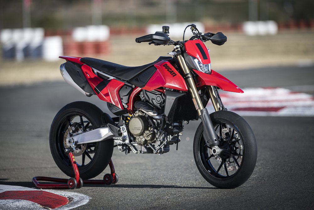 2024 Ducati Hypermotard 698 right side, on a racing rear stand, parked on a race track.
