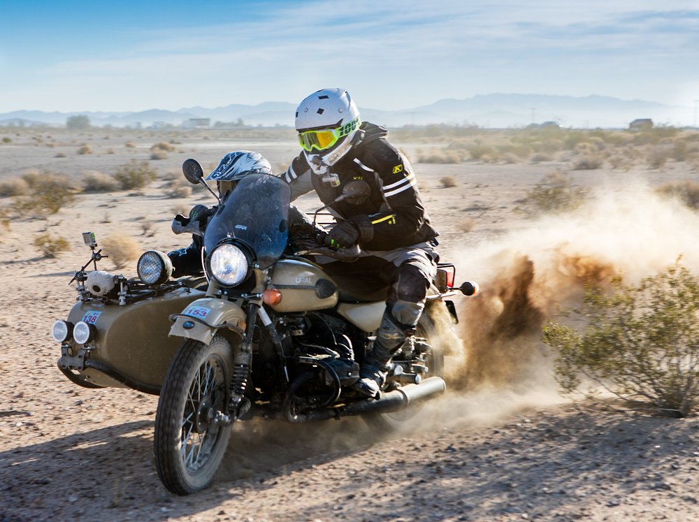 Spurgeon and Abhi in the sidecar off road in the desert