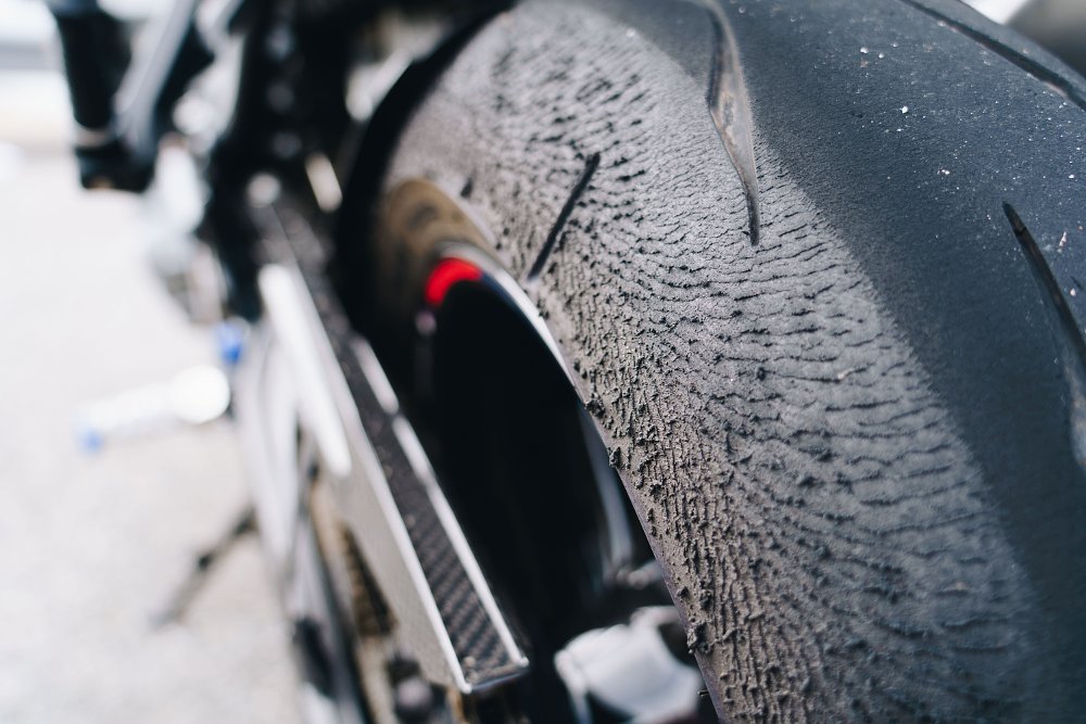 Bridgestone RS11 rear tire detail, taken after track use on a BMW M 1000 R.