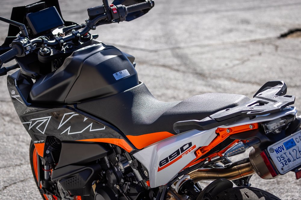 2024 KTM 890 SMT seat and rear rack detail, shot from left rear.