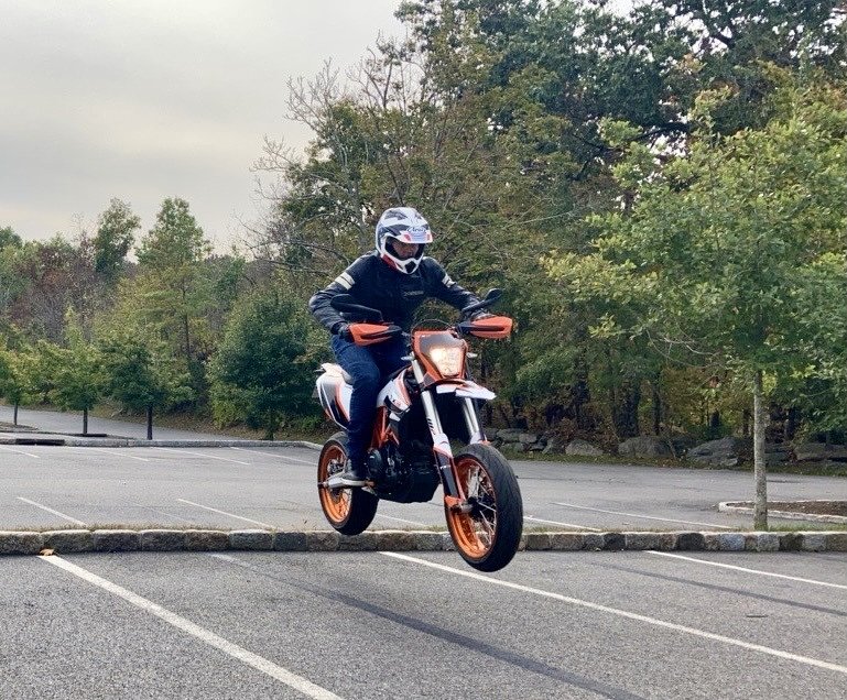 doing a small jump in a parking lot on the Tx3
