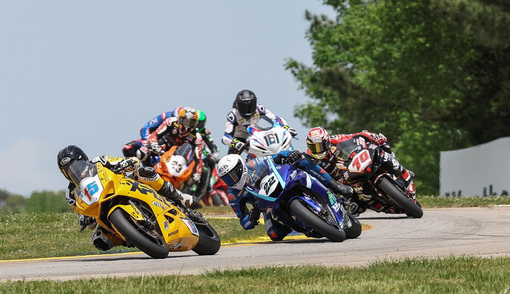 P.J. Jacobsen on a yellow Ducati leads the Supersport field through the esses at Road Atlanta