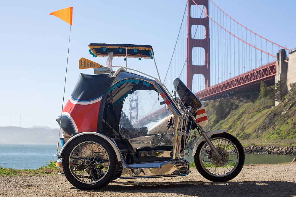 Traysikel parked in front of the Golden Gate Bridge