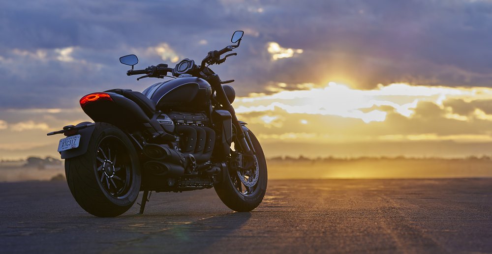 Rocket 3 Storm parked in front of a sunset