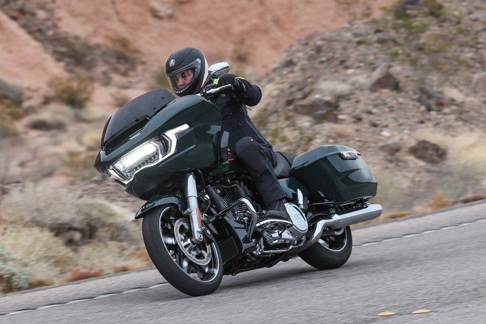 rider on a green Road Glide on a desert road