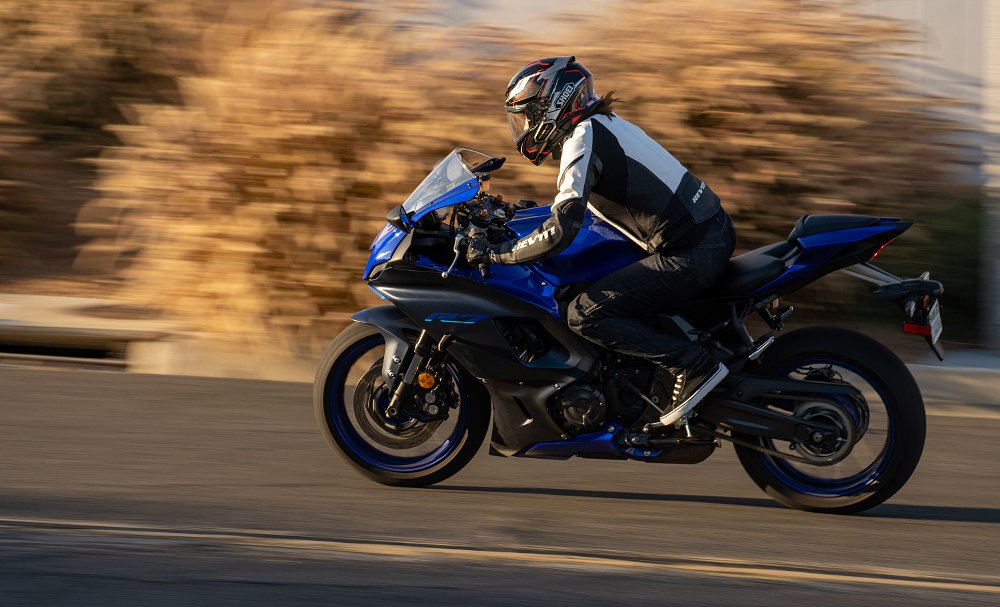 woman riding a YZF-R7 on the street