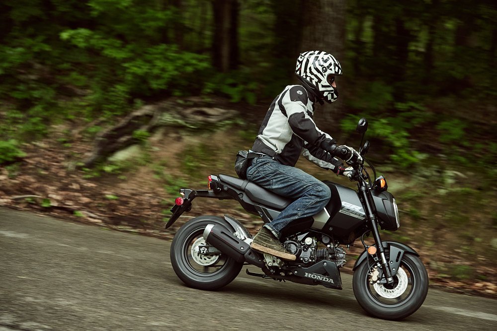 riding the black version of the Grom with the under cowl