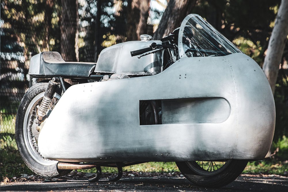 side view of the large aluminum fairing on the motorcycle