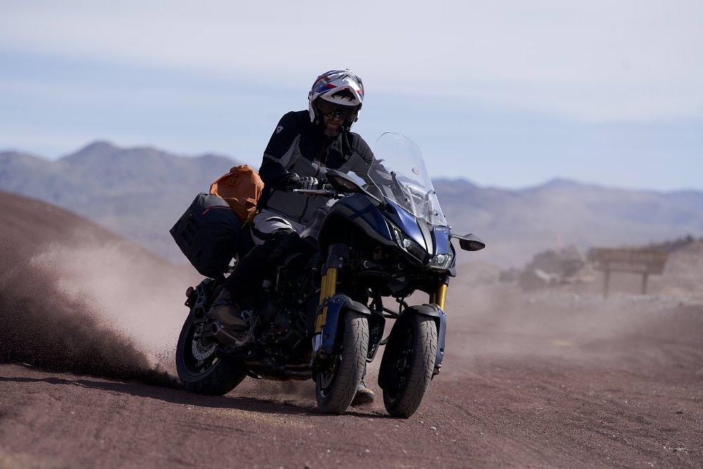 A 2019 Yamaha NIKEN sliding sideways on a gravel road.