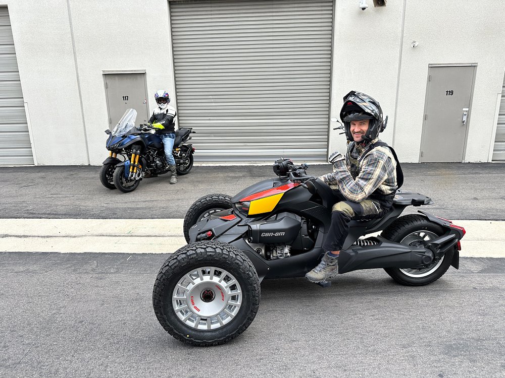 A Can-Am Ryker Rally and Yamaha NIKEN in front of a garage door, about to set out on a road trip.