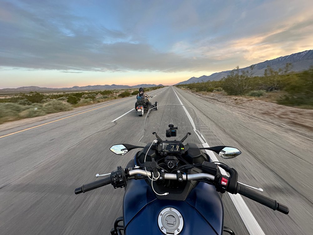 An on-board photo from the seat of a Yamaha NIKEN, riding behind a Can-Am Ryker Rally on the highway.