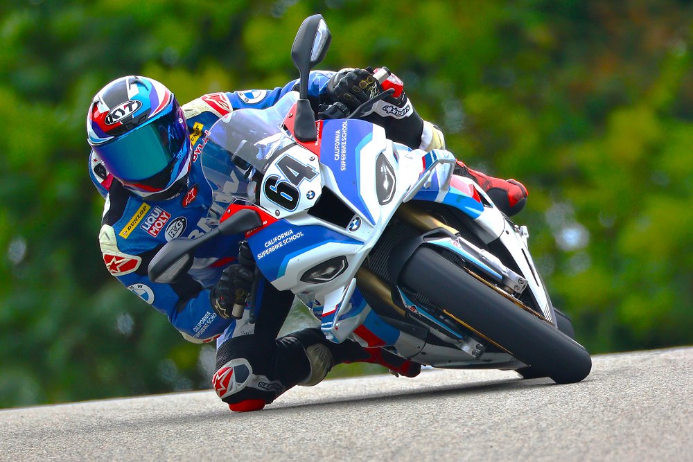 author leaned over on a motorcycle on the race track