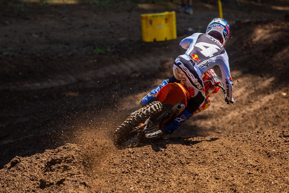 view of Chase Sexton from behind in a berm in a motocross race