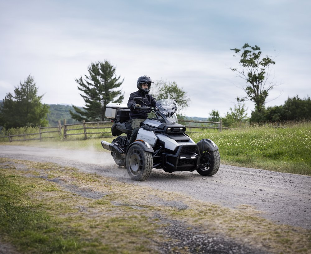 Rider on the Can-Am Canyon on a level unpaved gravel road