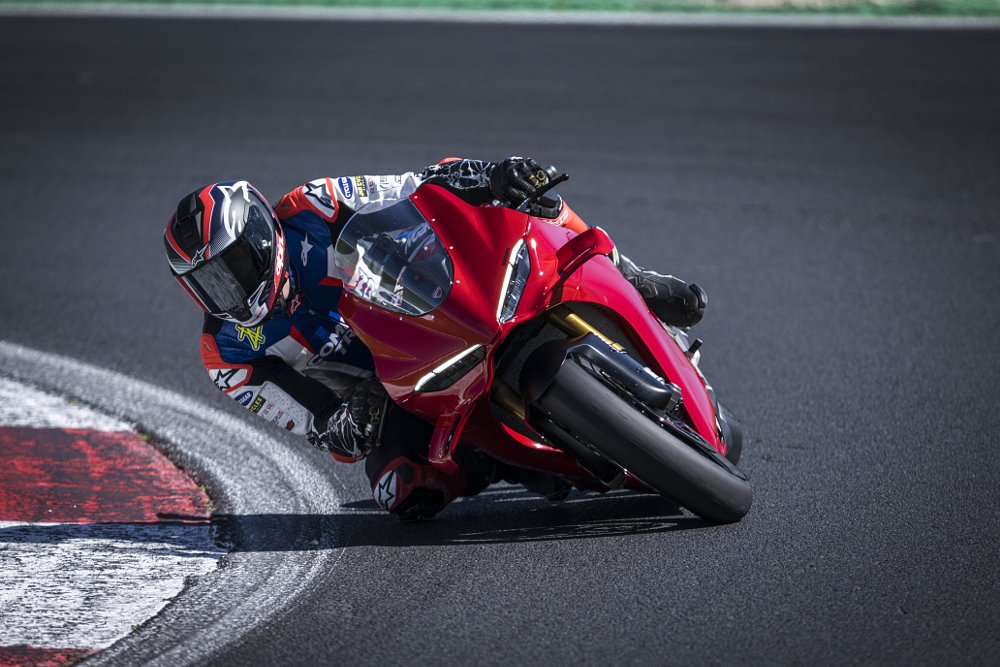 2025 Ducati Panigale V4 S turning right toward the camera on a race track.
