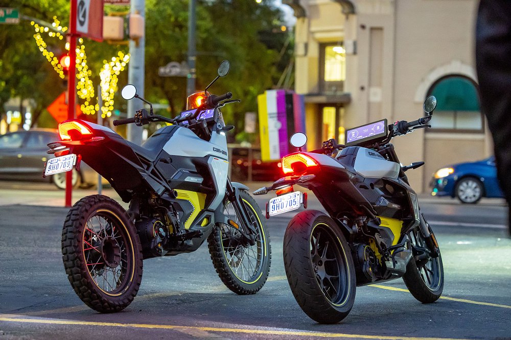 Origin and Pulse parked on an Austin city street at dusk