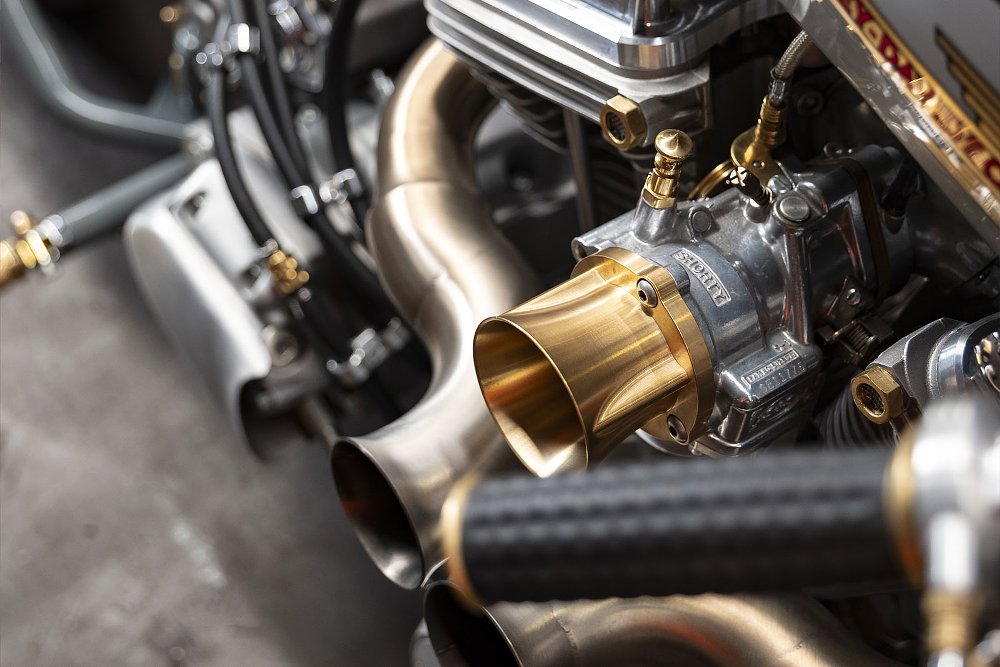 close view of the engine and carburetor with brass parts