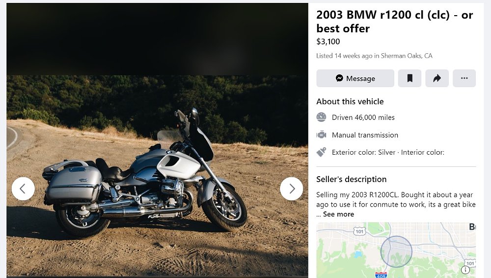 R 1200 CL cruiser in silver parked at a dirt turnout on a mountain road
