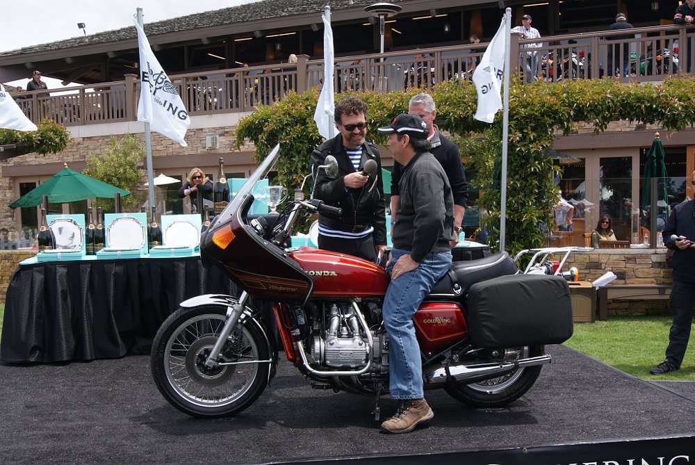 Albert Catelani sitting on his Gold Wing and being interviewed at the motorcycle show
