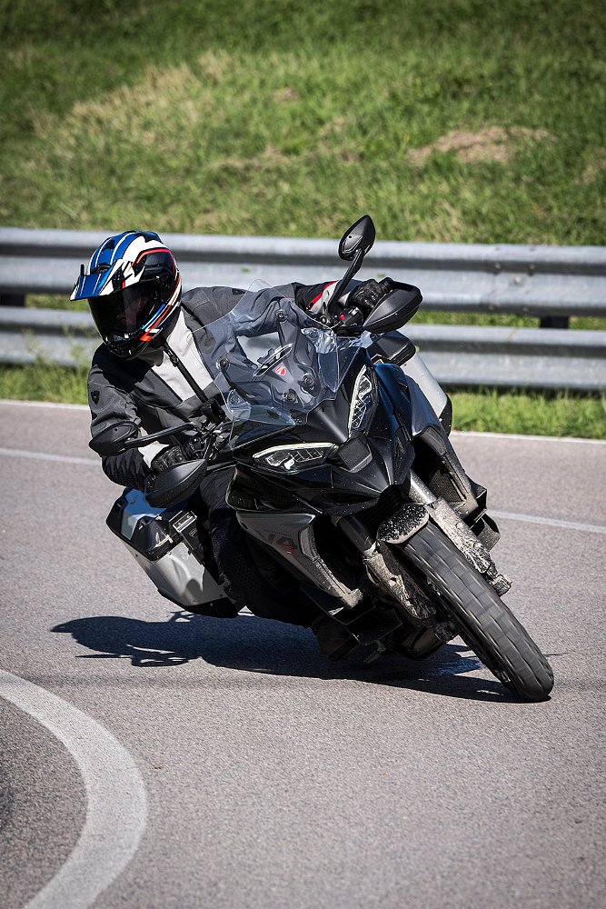 Dustin steers a loaded down Multistrada V4 around a bend. 