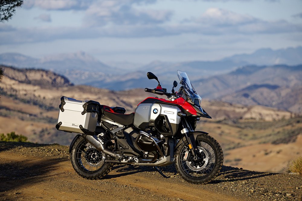 view of the R 1300 GS Adventure in red and silver in front of a mountain view